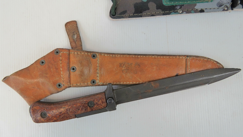 A Middle Eastern short sword, a dagger, a bayonet, and two Commando style knives with compasses. - Image 2 of 3