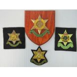 A contemporary Burma star plaque together with three blaze badges. Four items.