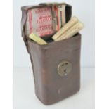 A vintage brown leather case containing a quantity of vintage First Aid items within including