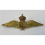 A yellow metal RAF badge with red white and blue enamel to central panel and crown, 3.4g.