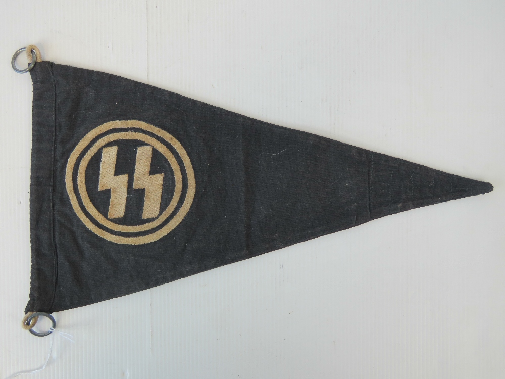 A German SS black cloth car pennant embroidered with SS runes and issue tag 127/41, 35.5cm.