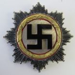 A WWII German Cross 'Gold' Award badge, pin stamped 1.