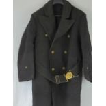 A WWII Japanese Navy coat, label inside, complete with brass buttons and belt with brass buckle.