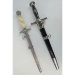 Two reproduction WWII German daggers.