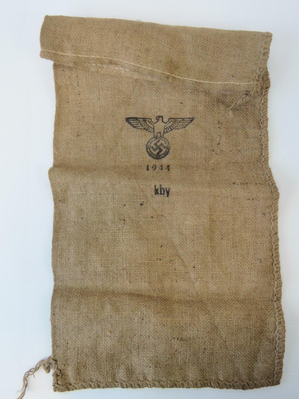 A WWII German hessian burlap sack with eagle swastika and dated 1944, 62cm x 30cm.