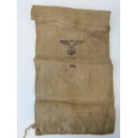 A WWII German hessian burlap sack with eagle swastika and dated 1944, 62cm x 30cm.