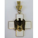 A WWII German Social Welfare medal with Oak Leaves clasp.