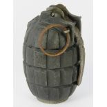 An inert WWI Mills grenade, complete with alloy base plug and dated 1915.