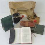 A vintage WWII general purpose canvas field dressing bag stamped AC 1942 with broad arrow,