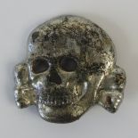 An SS white metal deaths head cap badge, 3cm.