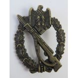 A WWII German Infantry Award badge, marked DH.