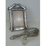 A HM silver photograph frame, complete with glass and wooden easel back, hallmarked Birmingham 1906,