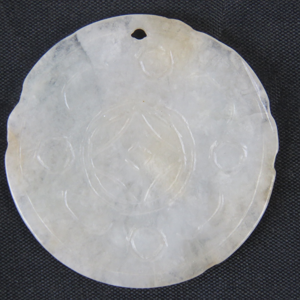 A mutton fat white jade carved disk pendant, 4.4cm dia, 11.3g. - Image 2 of 2