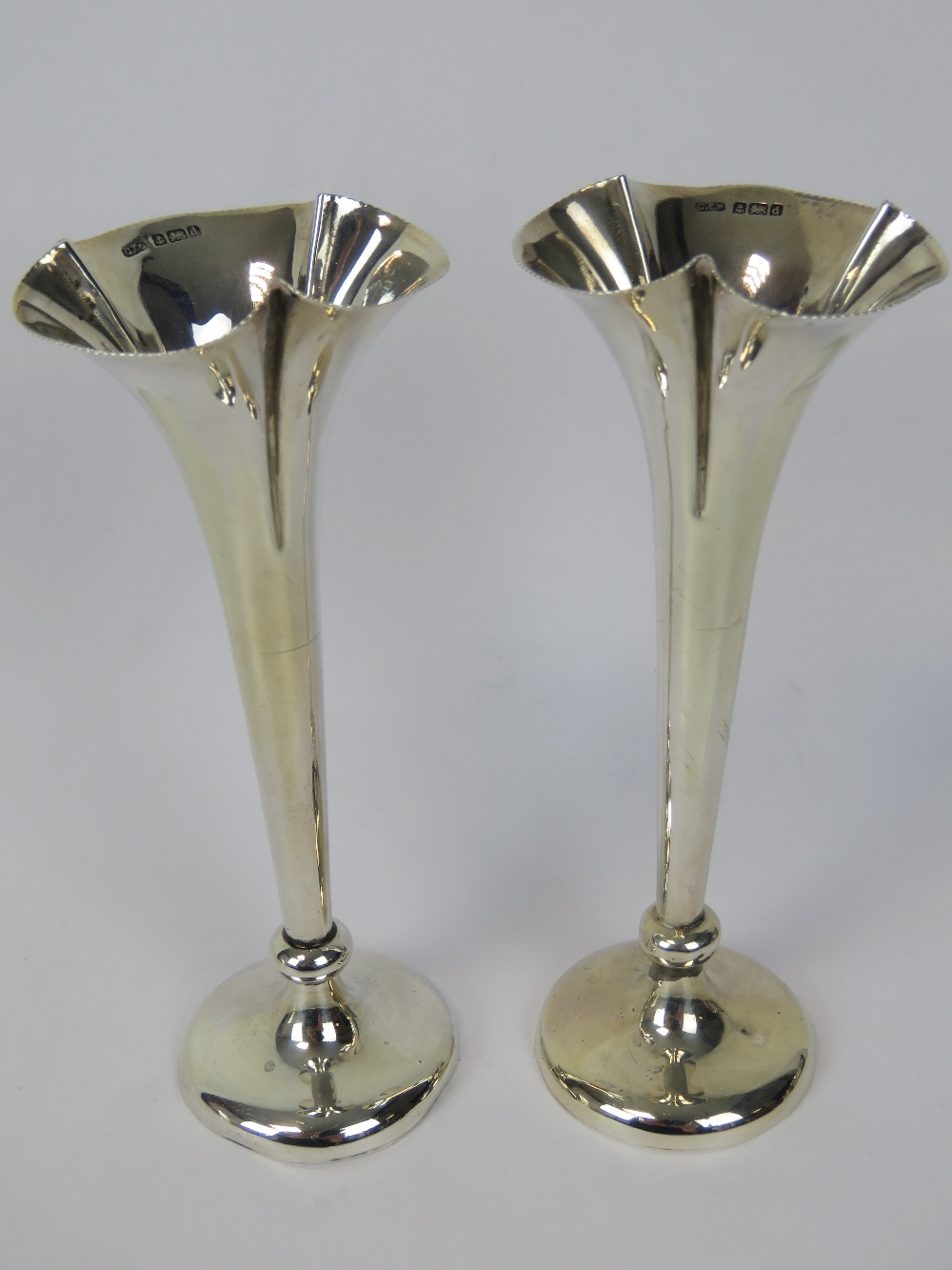 A pair of HM silver fluted rim bud vases, each hallmarked 1903, total weight 2.2ozt.