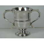 A Georgian HM silver twin handled cup with single foot,