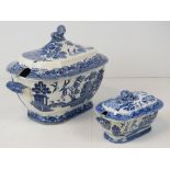 A large blue and white Willow pattern lidded tureen with end handles and lion handle,