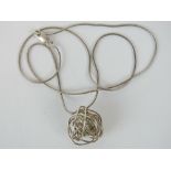 A silver snake link chain with twisted wirework pendant, stamped 925.