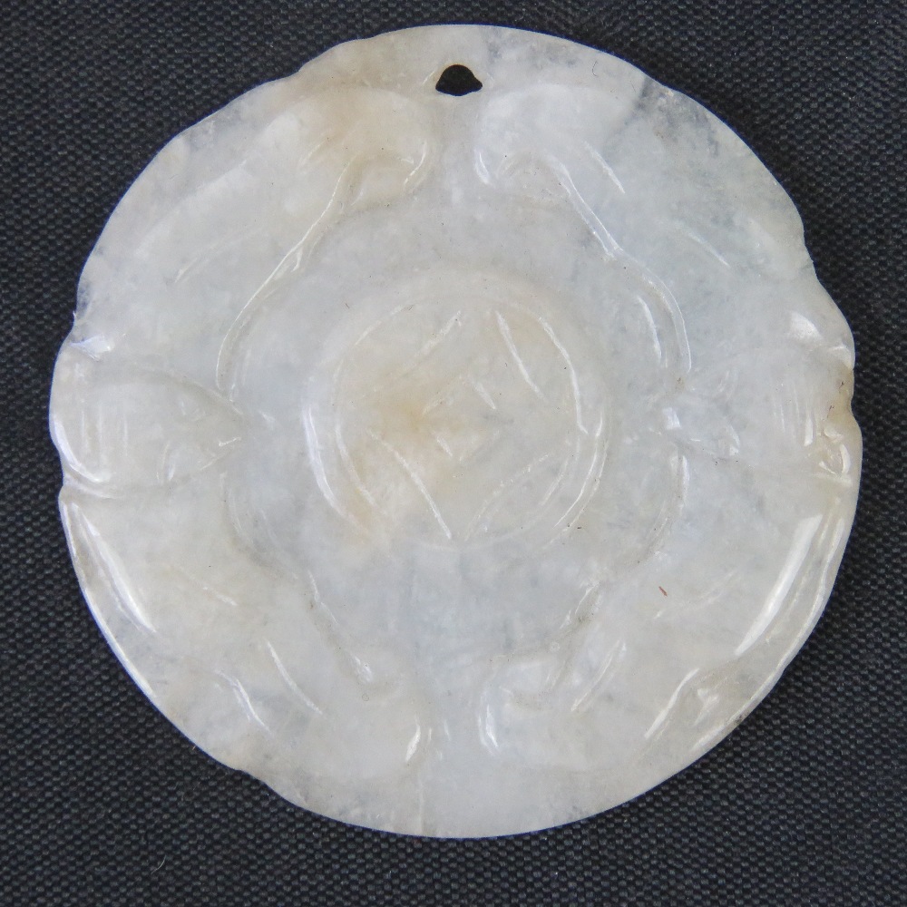 A mutton fat white jade carved disk pendant, 4.4cm dia, 11.3g.