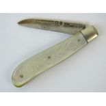 A HM silver and mother of pearl folding fruit knife, hallmarked Sheffield 1915.