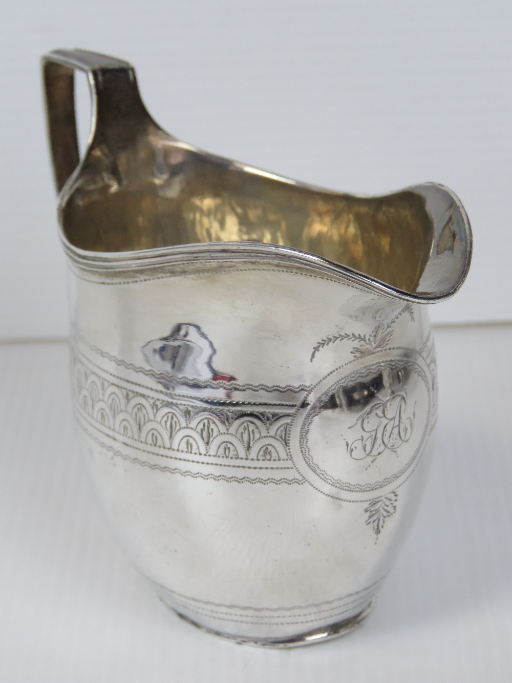 A Georgian HM silver jug, hallmarked London 1803, standing 9.5cm high, 3.2ozt.