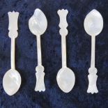 A set of four Georgian mother of pearl caviar spoons, terminals with foliate decoration, a/f.