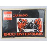 An Ecko car radio sign featuring Laurel and Hardy, 50cm x 75cm.