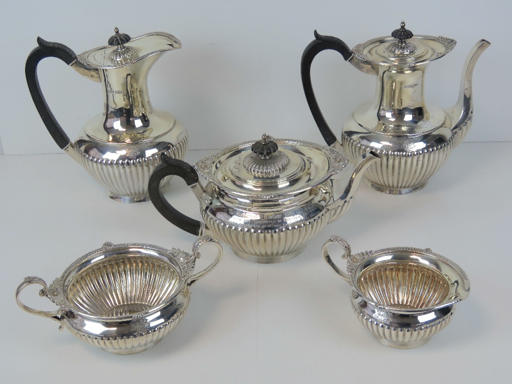 An impressive HM silver five piece silver tea and coffee service by Walker and Hall,