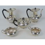 An impressive HM silver five piece silver tea and coffee service by Walker and Hall,