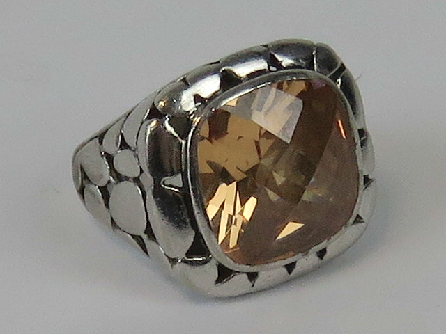A silver cocktail ring with large central fancy cushion cut stone, stamped 925, size P.