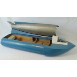 A vintage handmade pulse jet boat of wooden construction and complete with jet, a/f, 110cm.