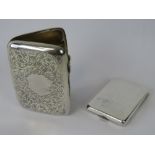 A HM silver cigarette case with foliate engraving, gilded interior, two elasticated straps,