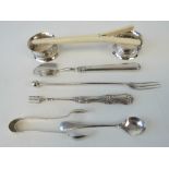 A pair of HM silver napkin rings together with HM silver pickle fork, salt spoon and sugar tongs.