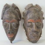 A pair of large and impressive carved wo