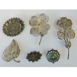 Six silver and white metal brooches incl