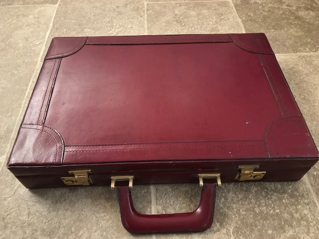 A fine burgundy leather brief case with