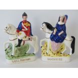 A pair of Staffordshire figurines on hor