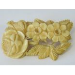 A 19th century carved ivory floral brooc
