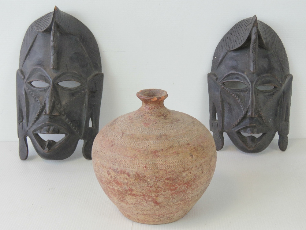 A pair of 20th century African pierced a