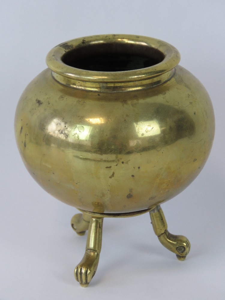 A gilt bronze censer raised over three o