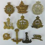 Ten Colonial military badges including;