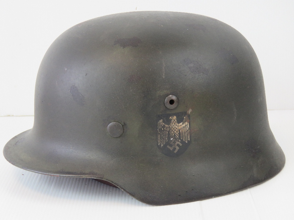 A WWII German Army helmet, single decal,