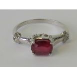 A silver and ruby ring,