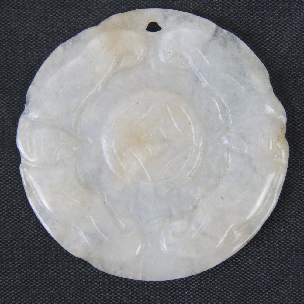 A mutton fat white jade carved disk pendant, 4.4cm dia, 11.