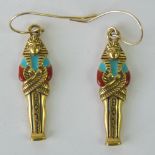 A pair of enamelled yellow metal earrings in the form of Pharaoh sarcophagi,