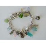 A HM silver charm bracelet with a quantity of assorted glass beads pearl,