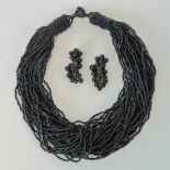 A pair of vintage German made black bead earrings, the drop in the form of a bunch of grapes,