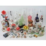 A modern Chinese caved jade figure, decorative bells, a miniature bottle of Guinness,