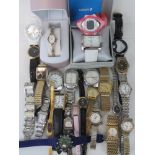 A quantity of assorted mens and ladies wristwatches.