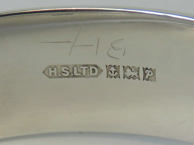 A HM silver bangle with engraved leaf pattern to front, complete with guard chain, - Image 2 of 2