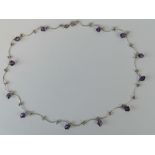 An unusual silver necklace with amethyst